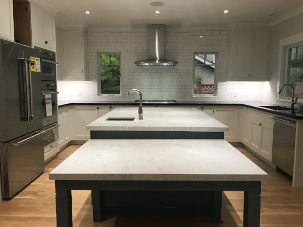 Gourmet kitchen with subway tile, custom cabinetry and top-of-the-line appliances.